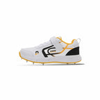 Side view of white and yellow Dnine Kings-2 cricket bowling spikes featuring an ankle strap, black branding accents, and metal cleats on a white background