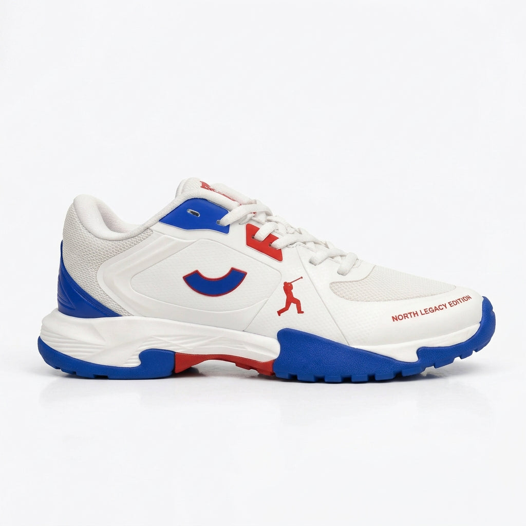 Side profile of the Tenxu All-Rounder cricket rubber shoes in white, blue, and red, featuring a durable TPU upper, patterned rubber outsole, and North Legacy Edition branding.