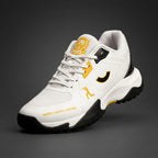 Angled front profile of the Tenxu All-Rounder cricket rubber shoes in white, yellow, and black, featuring a breathable mesh toe, yellow branding accents, and North Legacy Edition text on the mudguard.